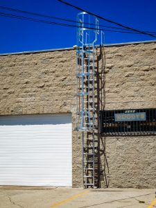 Aluminum fixed ladder on commercial building